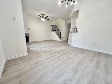 Unfurnished living room with stairway, a fireplace