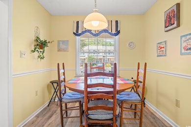 Dining room with wood finished floors and baseboards