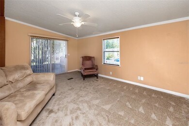 Living Room with Vaulted Ceilings and sliding door