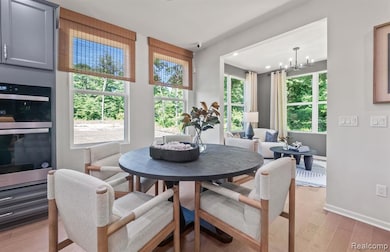 Beautiful Dining Room Area Leading to Cozy Sunroom
