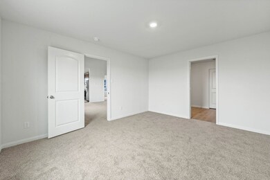 Empty room with baseboards and light carpet