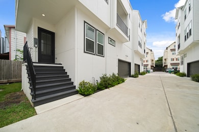 The front entry welcomes you with a staircase leading to a covered porch featuring an 8-foot front door, video doorbell and an exterior security camera. The front showcases cement board and Hardie Plank siding. The home also has a radient attic barrier making it energy efficient.