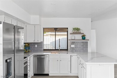 Kitchen with pass through window to Lanai