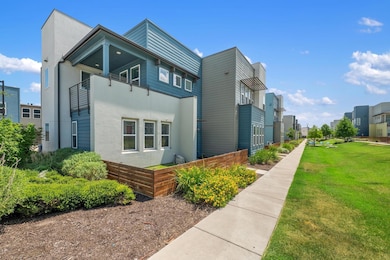 View of home's exterior with stucco siding, a residential view, and a lawn