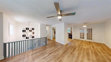 Spare room featuring french doors, light hardwood 