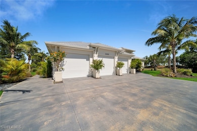 View of front of property featuring driveway, meta