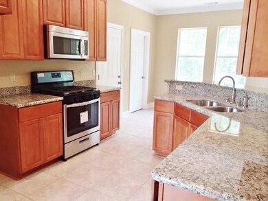 Kitchen is beautifully finished with granite, stai