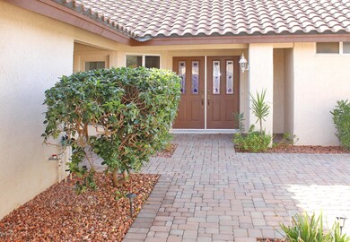 Double Entry Front Doors from Courtyard