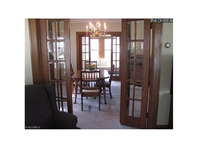 Much lustrous, natural woodwork and 2 sets of gorgeous French doors add to the Old World craftmanship of this home.