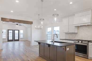 Kitchen featuring stainless steel gas stove, taste