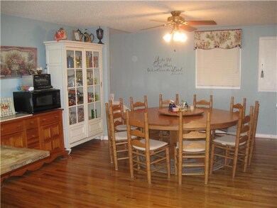 The dining area is large enough to hold a table for ten and several cabinets for storage.