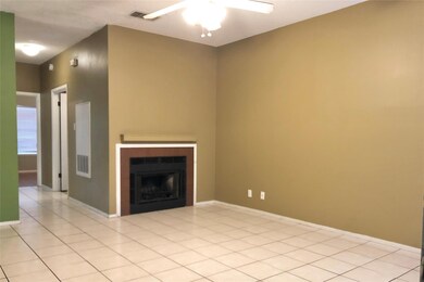 Unfurnished living room with baseboards, a firepl