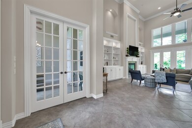 French doors off entry leading to office