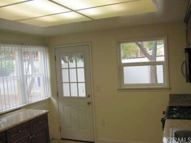 NEW 9-LIGHT DOOR LEADS FROM KITCHEN TO PRIVATE YAR