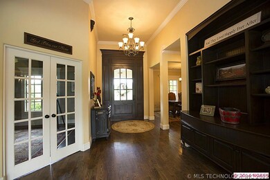 Entry with rich dark hardwoods, lots of light and
