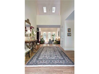 Dramatic 2-story vaulted entrance hallway