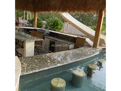 Property Photo. Swim up bar stools with water fall
