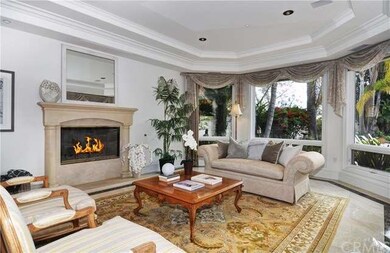 Coffered ceilings, cozy fireplace, crown molding a