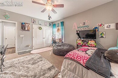 Bedroom featuring carpet flooring and ceiling fan