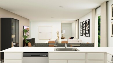 Kitchen featuring white cabinetry, sink, and stain