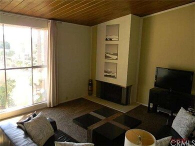 The living room has a big picture window that look
