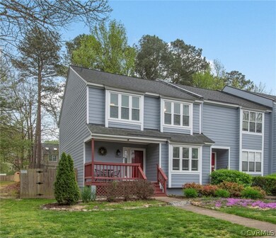 View of front of house with a porch and a front la