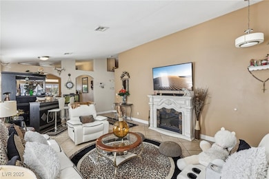 Living room with light tile patterned flooring and