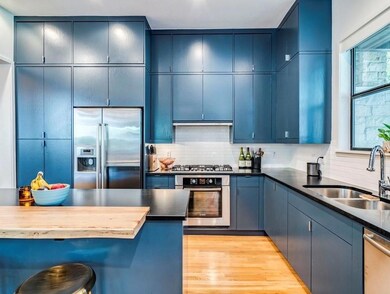 Kitchen featuring appliances with stainless steel
