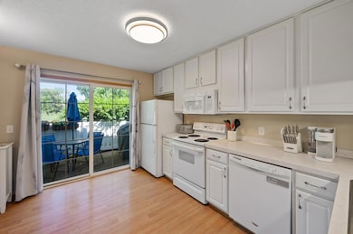 Kitchen with patio walk out with nature views