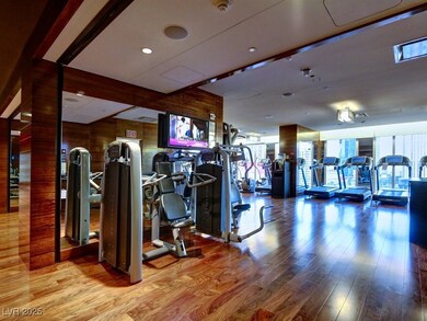 Exercise room featuring wooden walls and wood fini