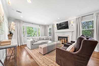 Living area with ornamental molding, a high end fi