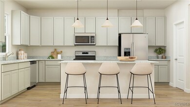 Kitchen with pendant lighting, appliances with sta