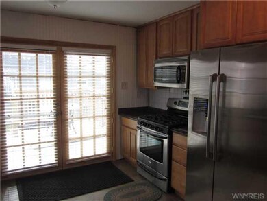 Kitchen Sliding glass doors off of kitchen leading