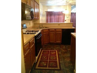 Cafeteria/Kitchen. Kitchen leading into dining are