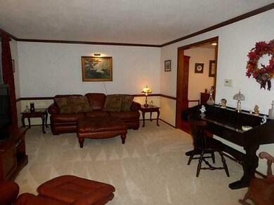 Living Room. Large room featuring crown moulding, 