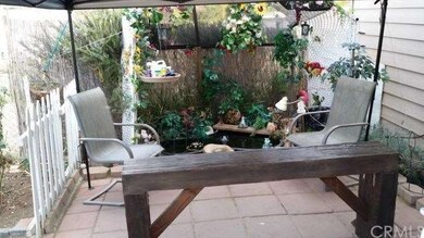 POND / SITTING AREA IN FRONT OF HOUSE