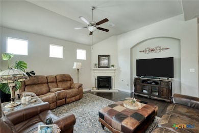 Features a corner fireplace and lots of windows, n