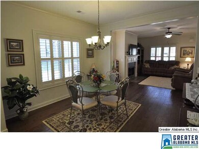 Open dining and living area, view from kitchen.