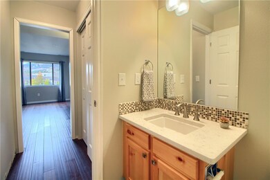 Upgraded 1/2 bath on main level with mosaic glass