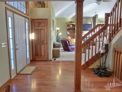 Two story foyer which opens to the cathedral ceili