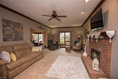 Family room with fireplace, neutral colors and cei
