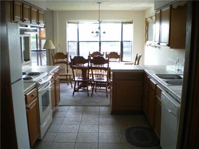 Kitchen. Refrigerator, microwave, washer, dryer, d