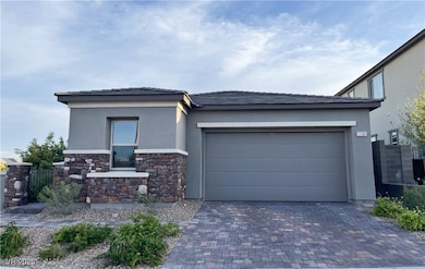 View of front of house featuring stucco siding, st