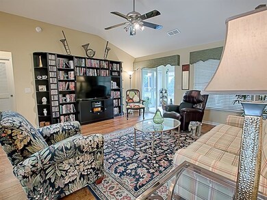 Living Room opens with sliding glass doors out to 