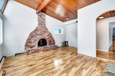 Living room with cozy fireplace . . .