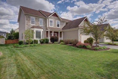 Upgraded elevation with stone/brick accents.  Beau