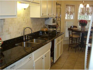 Granite countertops, stainless steel sink, three t