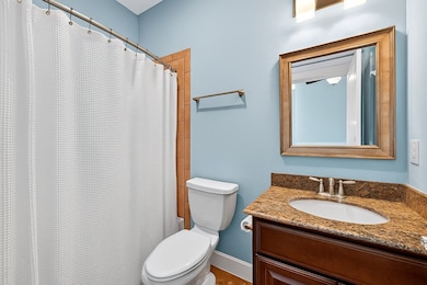 Full bath located inside first floor bedroom.