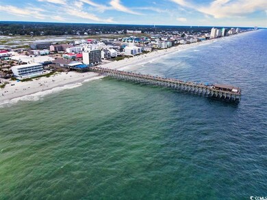 Birds eye view of property with a water view, a be
