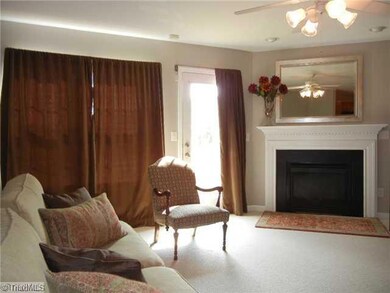 Living Room. Spacious living room has a fireplace with gas logs, spot lights over the  FP and a ceiling fan